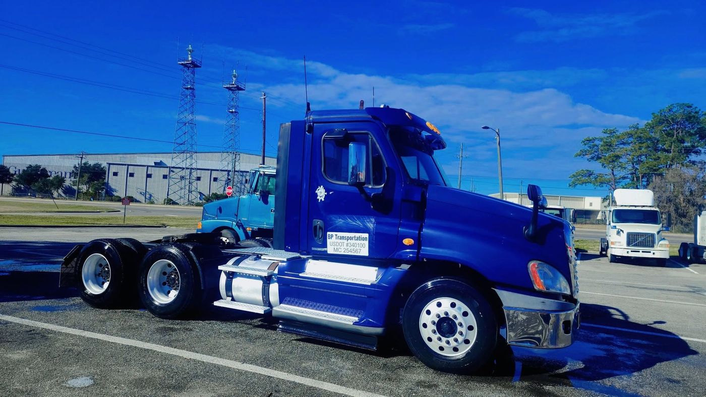 Freshly washed blue semi truck cab shining in the sun